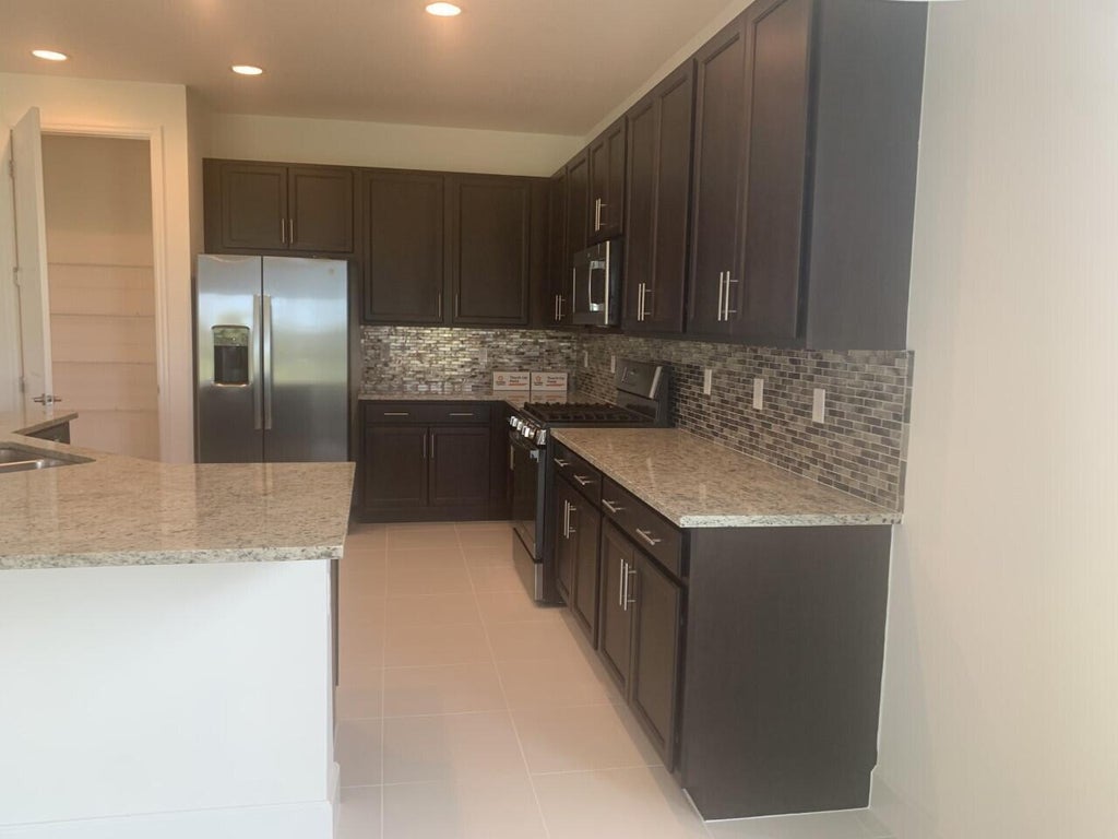 Photo of 11933 SW Poseidon Way, Port Saint Lucie, FL 34987 (MLS # B26066654)