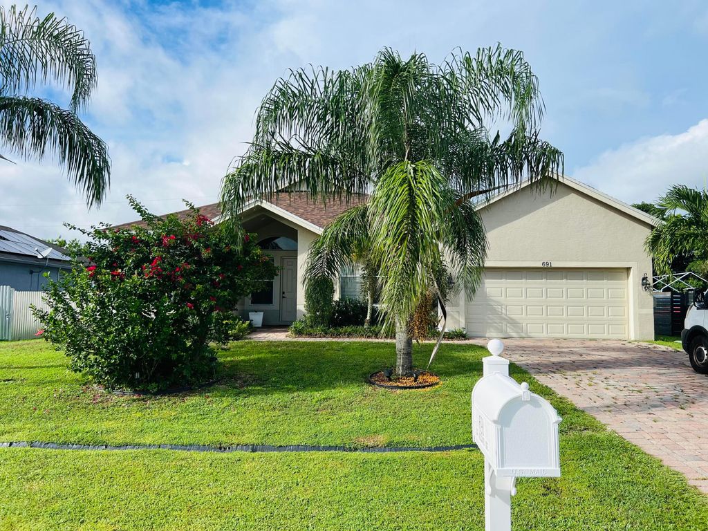 Photo of 691 SW Mccomb Avenue, Port Saint Lucie, FL 34983 (MLS # R11127957)