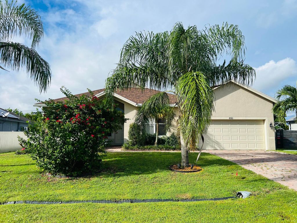 Photo of 691 SW Mccomb Avenue, Port Saint Lucie, FL 34983 (MLS # R11127957)