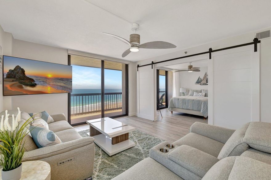 Wake up to the sound of waves and breathtaking panoramic ocean views from every room in this beautifully updated, fully furnished, turnkey condo. This light-filled unit features an open-concept living space with all impact windows draped with electric blinds that frame the sparkling shoreline. Enjoy morning coffee watching amazing sunrises or incredible evening sunsets from your private balcony overlooking the beach.The renovated kitchen is fully equipped with brand new appliances, quartz countertops flowing up into the backsplash, induction stove with brand new cookware, custom pantry and plenty of cabinet space, perfect for entertaining or quiet nights in.