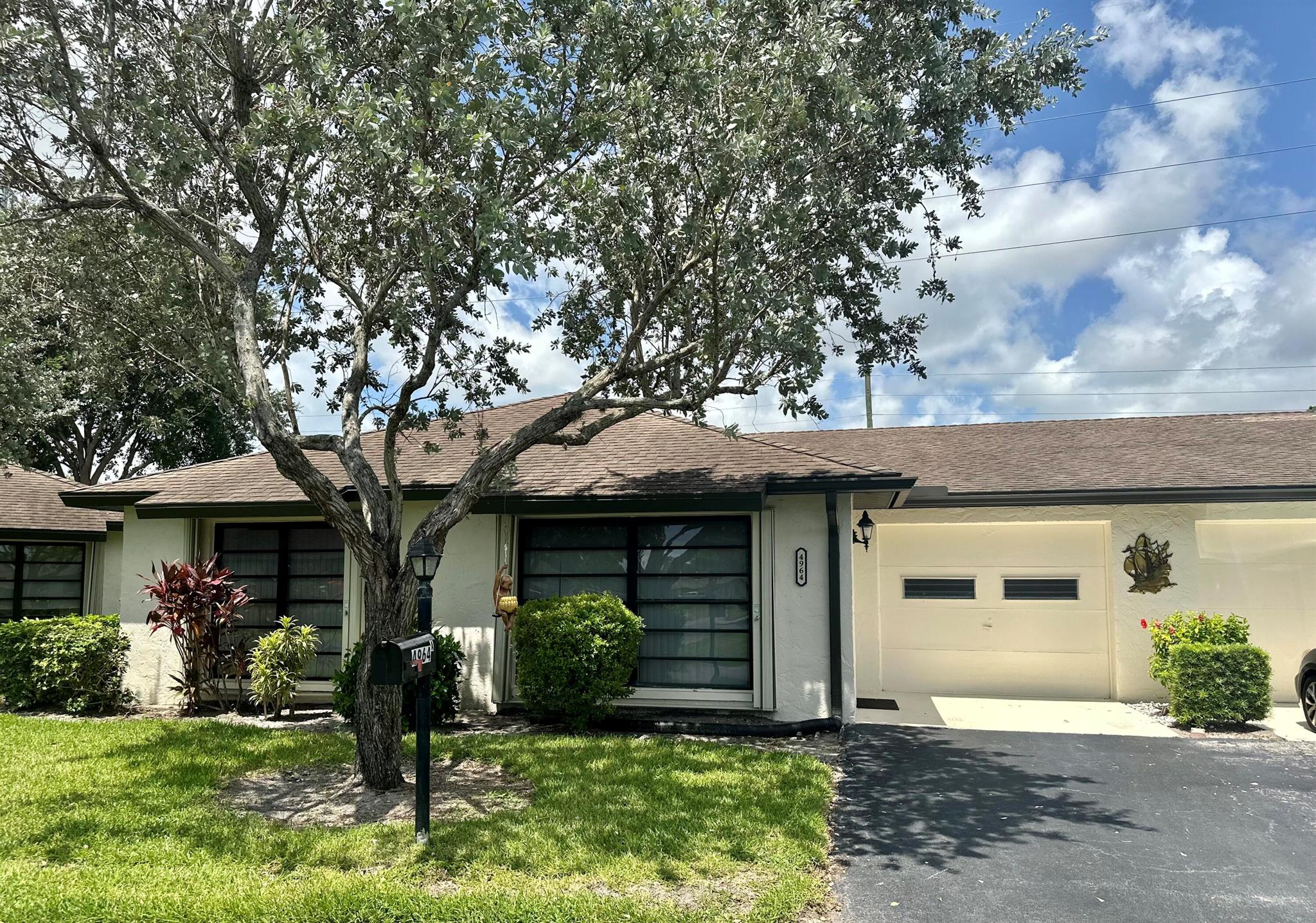 BEAUTIFUL UNIT WITH GARAGE*UPDATED KITCHEN AND BATHS*LARGE MODERN TILE THROUGHOUT HOME*NEW WASHER & DRYER, NEW AIR CONDITIONER*NEW GARAGE DOOR*FREE BASIC CABLE & WATER*THIS IS A GREAT OPPORTUNITY TO RENT IN A VERY WELL TAKEN CARE OF COMMUNITY55 & OLDER COMMUNTIY
