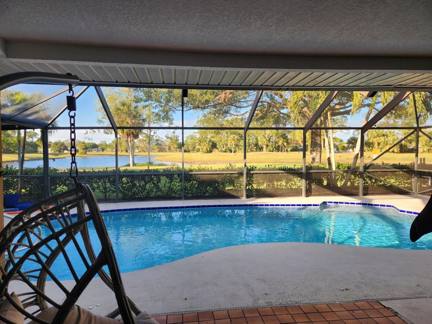 This exceptional pool home is perfectly positioned to capture stunning lake views from the pool deck and every rear-facing room. The expansive backyard offers plenty of space for sports and outdoor fun. Need room for your boat or RV? Park them securely behind the privacy fence on the gravel side yard, then rinse off in the outdoor shower. Inside, natural light fills the living room, dining room and family room, all seamlessly connected to the kitchen. Add'l $250/month if you add lawn, pool and pest control services.