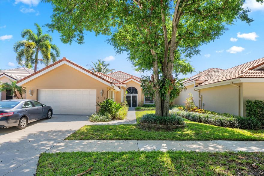 Located in The Hamptons at Maplewood—one of Jupiter's most sought-after DiVosta-built communities—this beautifully maintained home offers the perfect blend of comfort, style, and convenience in the heart of Jupiter.  Step inside to discover new tile flooring throughout the entire home, extending seamlessly to the screened porch. The spacious open floor plan features a desirable split-bedroom design, creating a light-filled layout ideal for both everyday living and entertaining.  This residence offers three bedrooms and two bathrooms, along with a two-car garage. The serene primary suite includes a walk-in closet, dual sinks, and a separate tub and shower—your own private retreat.  The eat-in kitchen is both functional and inviting, featuring a new microwave and garbage disposal, perfect fo perfect for casual dining and gatherings.  Ideally located, this home delivers modern living in one of Jupiter's most desirable communities.
