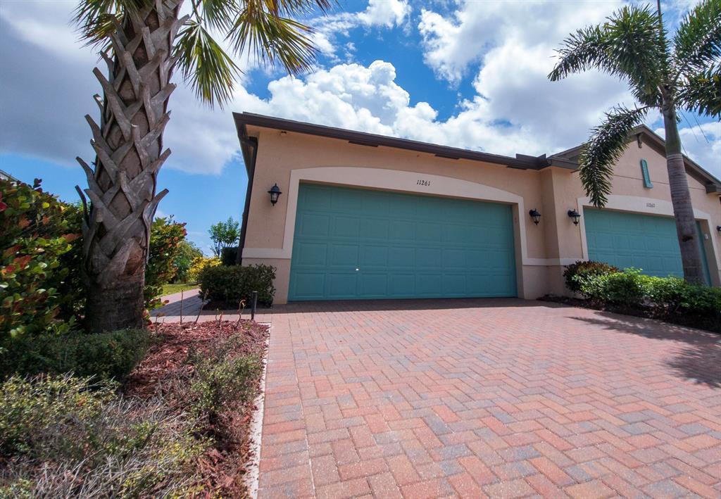 Beautiful, like new Villa in Lake Park. 55+ Community. Mahogany Model. Entrance has Glass Etched Door. Kitchen has Quartz Counters with Grey Wood Soft Close Cabinets. Stainless Steel Refrigerator, Range, Dishwasher and Microwave. New Garbage Disposal. Glass Tile Back Splash. Three Counter Stools included. Great Room with Pond and Nature View. Primary Bedroom and Bathroom, Guest Bedroom, Guest Bathroom. Office/Den with built in Desk included. In unit Laundry Room with Sink, Storage and Full Size Washer & Dryer. Impact Windows all around. Blinds and Verticals are included. 2 New Ceiling Fans and Light Fixtures included. The Pavers in the Driveway and Lanai are reset, cleaned and sealed. 2 Car Garage with Storage Cabinets. Central A/C has been serviced on schedule,