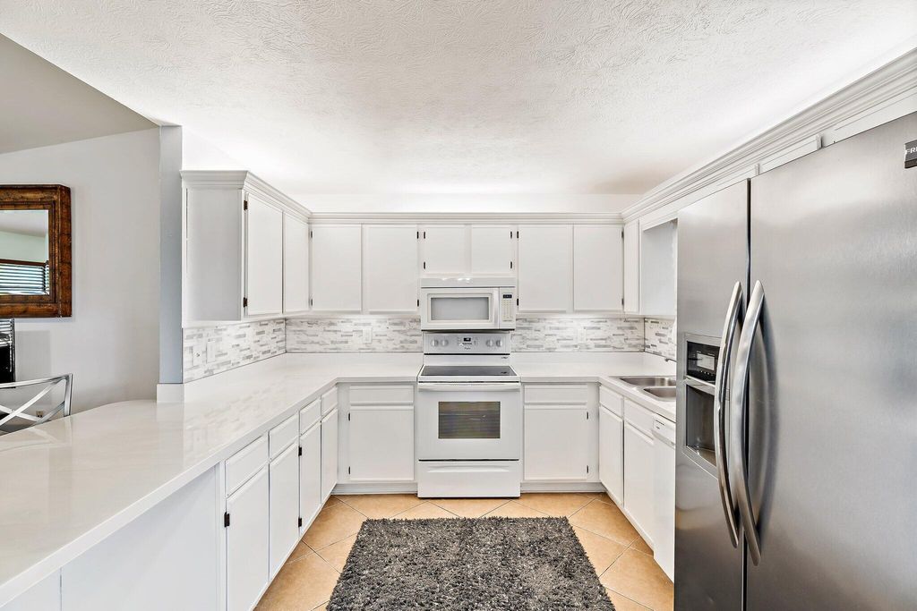 Photo of 1026 SW Bianca Avenue, Port Saint Lucie, FL 34953 (MLS # R11108056)