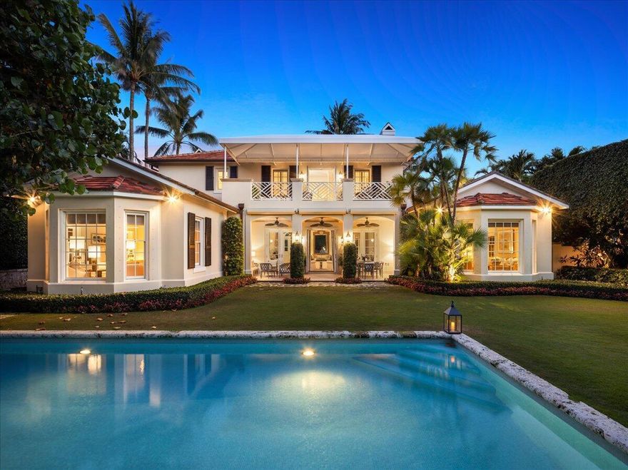 This absolutely stunning Old Palm Beach style custom estate designed by Tom Kirchhoff and featured in Architectural Digest is in outstanding condition on one of the most desirable north end streets with direct beach and Lake Trail street access. Meticulous and thoughtful, its many details include well scaled rooms, ultra high ceilings, downstairs primary suite with dual baths and bay window overlooking the lush gardens by Mario Nievera. Its free flowing floor plan includes an open kitchen, breakfast and family room, formal dining room, library, two amazing outdoor loggias, gracious two story foyer, beautiful millwork and pecky cypress. This is one of the most serene properties with a fabulous pool and spa to relax and enjoy everything harmonious for wonderful indoor/outdoor living.