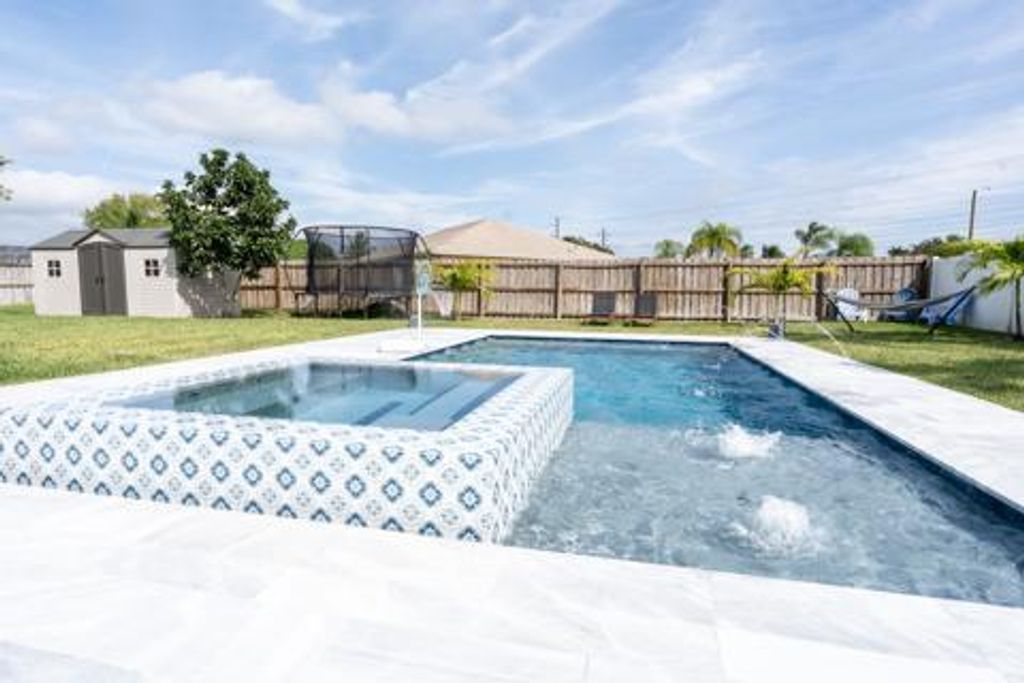 Photo of 351 La Mancha Avenue, Royal Palm Beach, FL 33411 (MLS # R11135187)