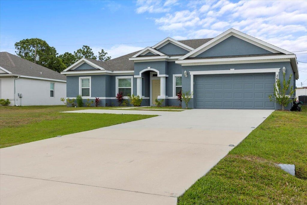 Photo of 2661 SW Import Drive, Port Saint Lucie, FL 34987 (MLS # R11100623)