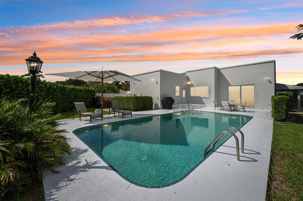 Photo of 257 N Country Club Drive, Atlantis, FL 33462 (MLS # R11121076)