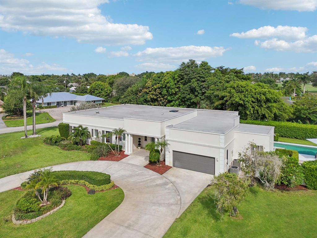 Photo of 257 N Country Club Drive, Atlantis, FL 33462 (MLS # R11121076)