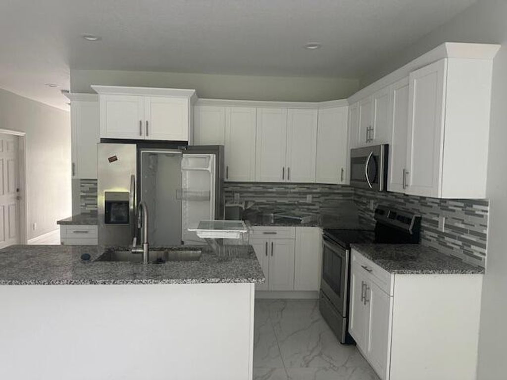 Photo of 346 Perry Avenue, Greenacres, FL 33463 (MLS # R11163722)