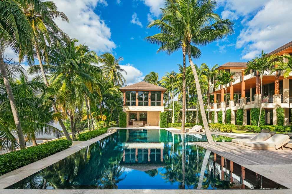 Located in Manalapan, Florida this ocean-to-Intracoastal compound is situated on 1.9 acres boasting 160 feet of direct oceanfrontage and Intracoastal. Offered fully furnished, the residence offers a Pacific Island Modern style with over 18,100 total square feet, resort-style grounds, and tunnel under A1A to beach house. The custom built home was created to invite the outdoors in with abundant outdoor living areas and endless ocean and Intracoastal views. Features include full floor master wing; custom wine cellar; heated salt-water infinity edge pool and expansive manicured grounds. Enjoy the private dock with boat lift and easy access to ocean via inlet. The gated compound is exceptional and offers every opportunity for enjoying a luxurious lifestyle along the South Florida coastline.