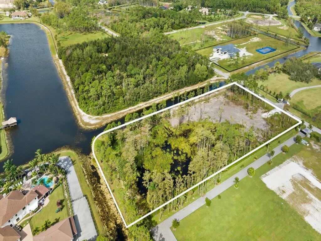Discover the unparalleled beauty of this 5-acre lot with a captivating lake view in Homeland, a truly rare and exceptional asset. Nestled within an equestrian neighborhood that borders over 145,000 acres of pristine wilderness, this property offers a unique blend of natural tranquility and urban convenience. Imagine waking up to the sight of roaming deer in this picturesque and peaceful setting, all while enjoying the modern amenities of ''in-town'' living.With ample space to build your dream home, guest house, barn, covered arena, and riding ring on this cleared 5-acre lot, the possibilities are endless. Free from wetlands, which typically incur development costs of up to $120,000 per acre, this property presents a valuable investment opportunity.