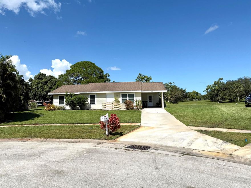 Centrally located on a quiet cul-de-sac . Tile throughout the whole house, kitchen remodeled and bathroom vanities have been replaced. Large screen porch overlooking private yard. Impact windows on the front of the house.