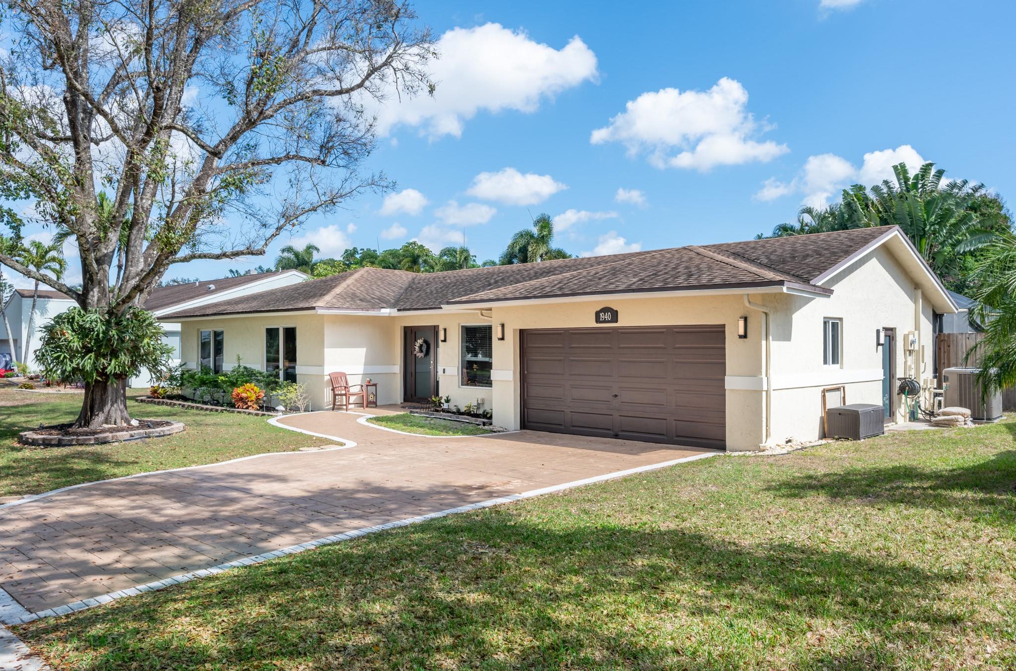 STUNNING HOME IN THE HIGHLY SOUGHT-AFTER ROYAL PALM AREA OF PLANTATION! THIS BEAUTY BOASTS INCREDIBLE CURB APPEAL WITH LUSH LANDSCAPING AND A STAMPED DRIVEWAY. INSIDE, ENJOY A CHARMING LIVING ROOM, FORMAL DINING, AND A KITCHEN WITH NEW STAINLESS STEEL APPLIANCES. SPACIOUS BEDROOMS OFFER COMFORT, WHILE THE SERENE COVERED PATIO WITH PLENTY OF SPACE FOR A SUMMER KITCHEN FEATURES A SCREENED-IN POOL AND AMPLE LAWN SPACE FOR ENTERTAINING OR PETS. NO HOA! CONVENIENTLY LOCATED NEAR TOP SHOPPING, DINING, SCHOOLS, AIRPORT, PORT, AND BEACHES. UPGRADES INCLUDE 2019 A/C, WATER HEATER, AND ELECTRIC PANEL, PLUS 2022 IMPACT WINDOWS & DOORS. A MUST-SEE!