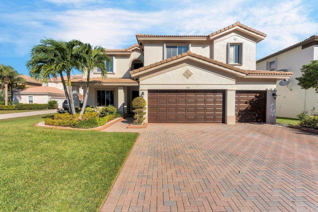 Photo of 112 Ibisca Terrace, Royal Palm Beach, FL 33411 (MLS # R11154466)