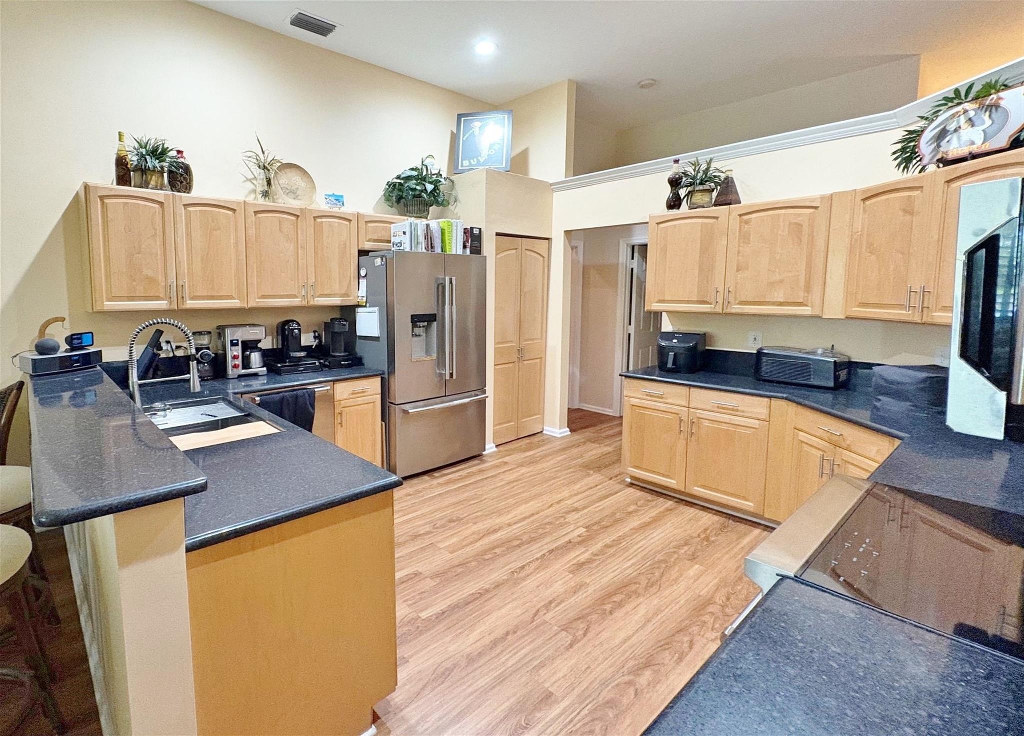 Step into this meticulously maintained 3 bedroom/2 bath waterfront home. Located in Swan's Landing, a serene part of Regency Lakes at Coconut Creek. This beautiful home is one of the largest 3/2 single story homes on the market in the subdivision. Volume ceilings. A cook's kitchen: JennAir fridge & M/W, Wolf Range, Cove D/W, LG W/D. Great water views up the canal. Fruit trees (bananas and mangoes) screened-in porch and fenced-in back yard perfect for the special dog in your life. This home boasts a two-year-old roof and five-year-old central A/C. Accordian shutters all around. Great two-car garage. Swan's Landing has its own pool just 113 steps away or use the clubhouse pool/hot tub, workout room, volleyball & basketball courts & kid's area. Close to schools, dining, Sawgrass Exp and more.
