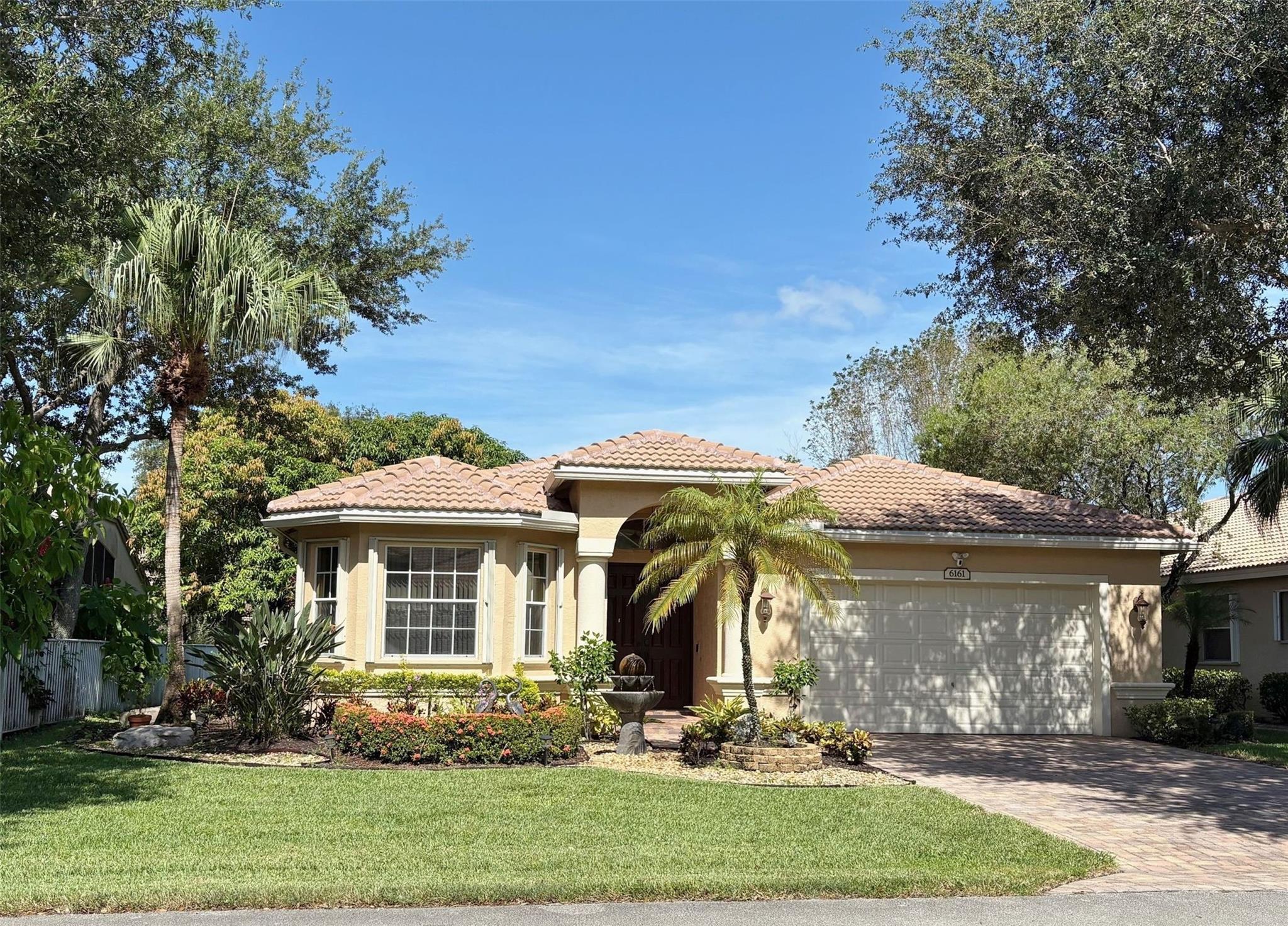 Step into this meticulously maintained 3 bedroom/2 bath waterfront home. Located in Swan's Landing, a serene part of Regency Lakes at Coconut Creek. This beautiful home is one of the largest 3/2 single story homes on the market in the subdivision. Large, spacious and airy with volume ceilings. A cook's kitchen with top-of-the-line appliances. Great water views up the canal. Fruit trees (bananas and mangoes) screened-in porch and fenced-in back yard perfect for the special dog in your life. This home boasts a two-year-old roof and five-year-old central A/C. Accordian shutters all around. Great two-car garage. Swan's Landing has it's own pool or use the clubhouse pool/hot tub. There is a clubhouse, workout room, volleyball & basketball courts & kid's area. Close to schools, dining and more.