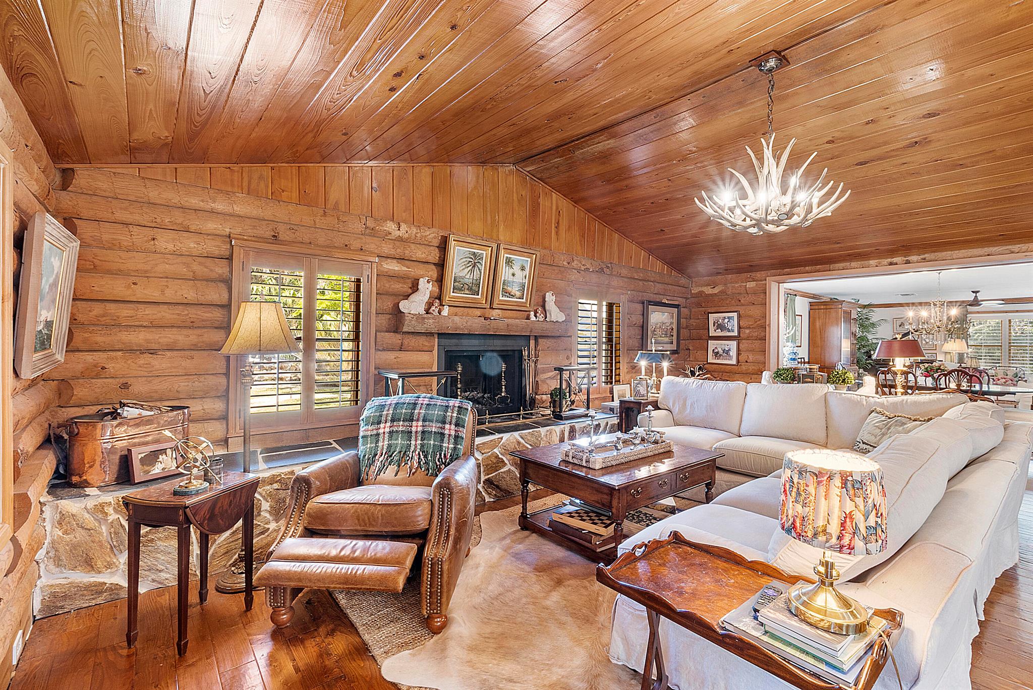 Step into a life less ordinary in this designer-owned escape on 5.13 pristine acres in Florida's most unique community. A beautifully appointed main residence and guest cottage tucked beneath ancient oaks. Every corner reflects warmth, serenity, and connection to nature. Beyond the doorstep lies a world unlike any other: 3,000 acres of private land with over 150 miles of off-road trails, stocked fish ponds, stables, horse ring, skeet shooting, rifle range, and big game hunting reserved for members. Enjoy pickleball and tennis courts, pool and fitness center with yoga, lodge, restaurant, outdoor chapel, grills, and charming Beer Tree, where neighbors become lifelong friends. Fly in via private air strip/hangar. On-property pond, golf, and barn w/ stables. A legacy of freedom and tradition!