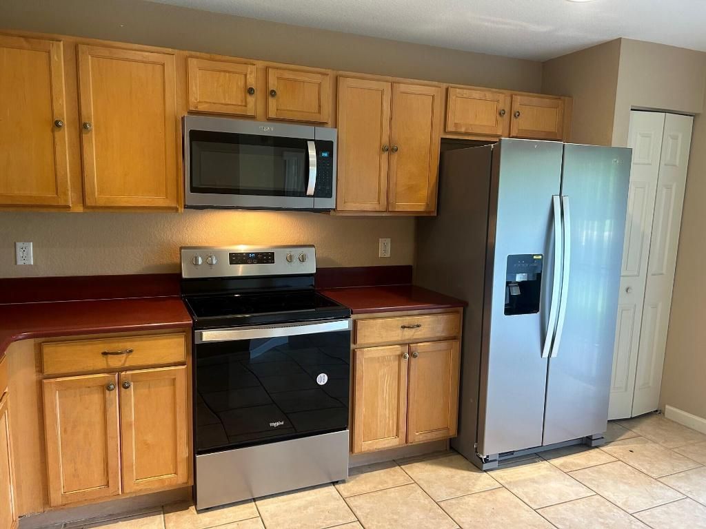 Photo of 5606 Crossing Rocks Court, Riviera Beach, FL 33407 (MLS # R10997363)