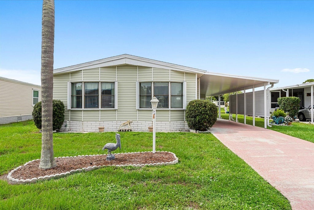 Photo of 484 TROPICAL ISLES Circle #D-32, Fort Pierce, FL 34982 (MLS # B26058329)