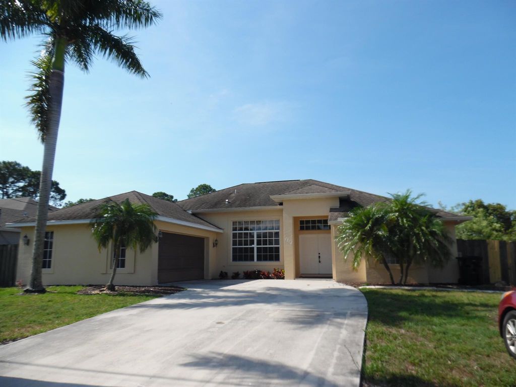 Photo of 1214 SW Emerald Avenue, Port Saint Lucie, FL 34953 (MLS # R10990632)