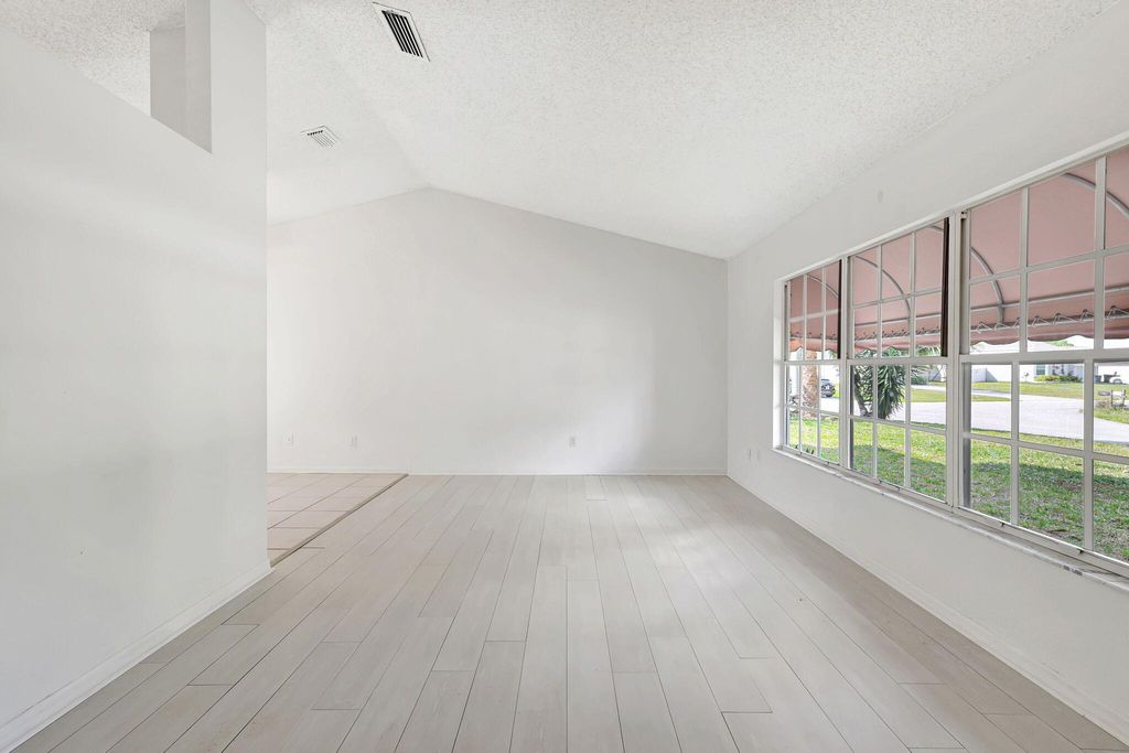 Photo of 4433 SW Bonney Street, Port Saint Lucie, FL 34953 (MLS # R10972240)