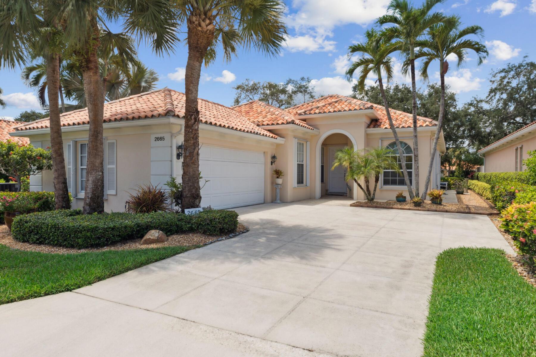 The Charm & Provenance of this One Owner Residence is what separates it from the Rest! That Sense of Warmth & Heritage, rarely found in Newer Homes, is the Essence of this Residence! It's One of the Reasons why this is a Unique Opportunity! This Pristine Oakmont is In the Fantastic 24 Hour Manned Gated Community of Riverwalk! One of the Best Locations in Palm Beach County, 15-20 minutes to Everything including Palm Beach, the Ocean & Airport! The Residence, is Impressive & Commanding, as it's Sited on a Lush, Professionally Landscaped & Maintained, Wide, Parcel, like No Other with Extensive Tropical Gardens & Beds, has a Side Loading 2 Car Garage with a Lush Expansive Motor Court that leads to the Screened Covered Ceramic Tile Entry that opens to the Gracious Foyer (Fixture Excluded) with