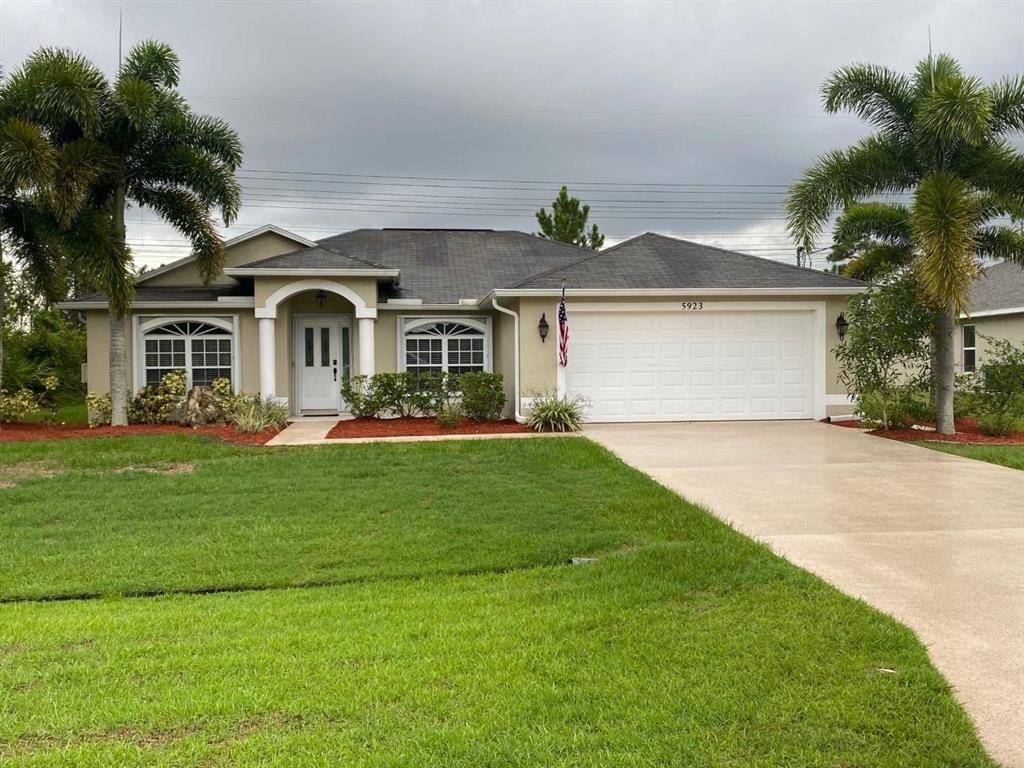 Photo of 5923 NW Hann Drive, Port Saint Lucie, FL 34986 (MLS # R10718427)