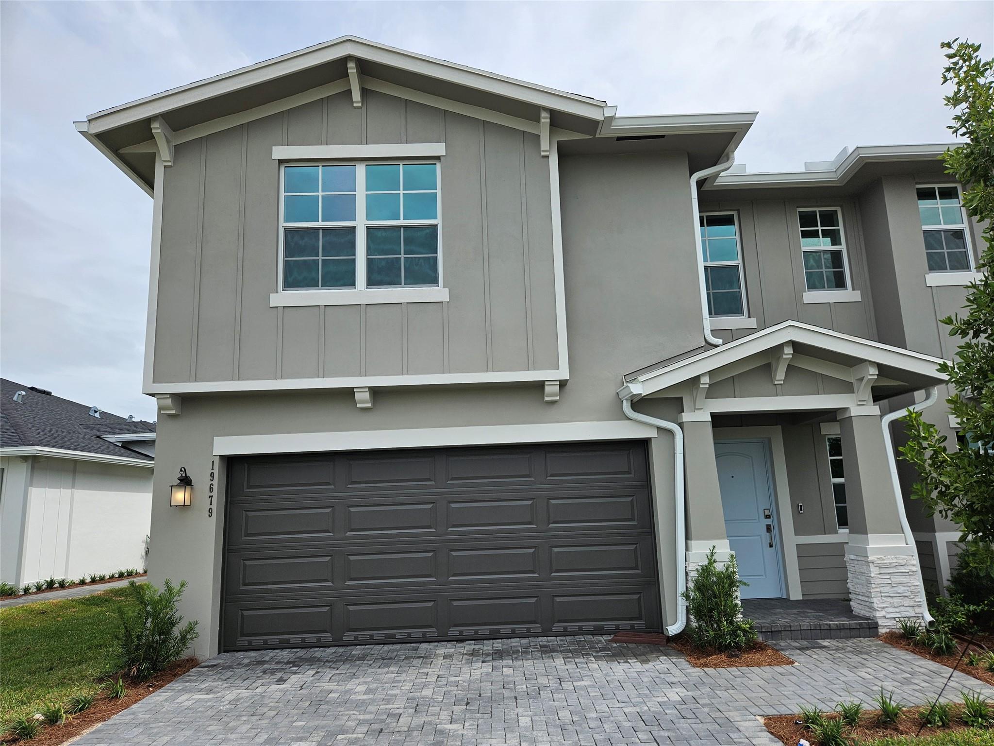 New Construction! This stunning two-story twin home offers an open-concept design on the first floor, featuring a spacious Great Room, a fully equipped kitchen with quartz countertops, all-new stainless steel appliances, including a gas range with a griddle and a built-in microwave, and a lovely dining area. A covered lanai at the rear provides the perfect space for outdoor activities. Upstairs, a cozy loft is surrounded by 2 secondary bedrooms, one junior suite and owner's suite. Two-car garage. Arden amenities include community lake house with wifi cafe bar, screened patio with fireplace, tennis, playground, 20 miles of walking trails , 2 resort style pools and so much more. Arden community is zoned for A+ school. Arden summer programs for kids.