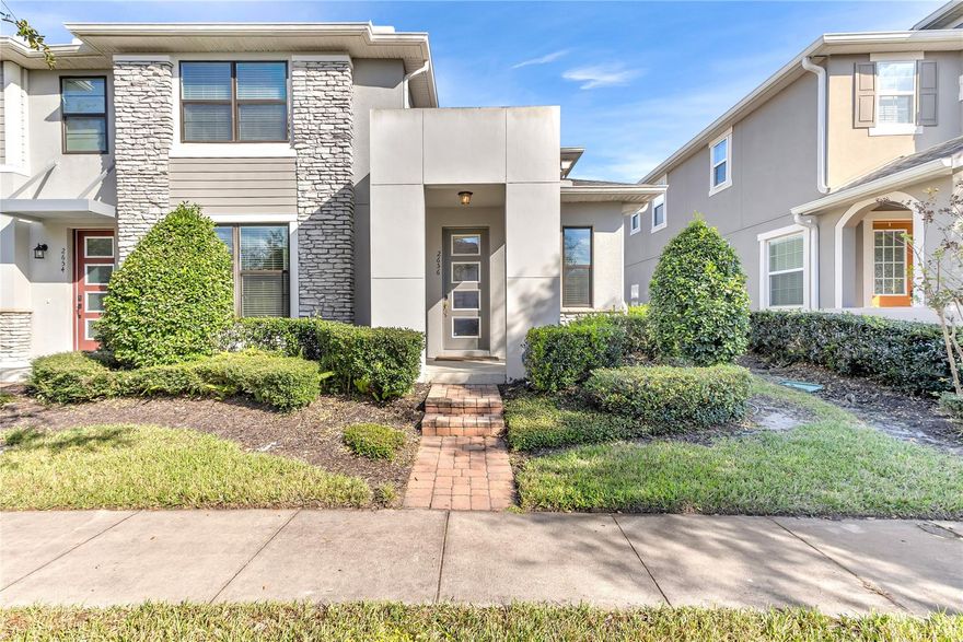 3bedroom, 2.5 bath, 2 car garage townhouse located in the Gated community of Tapestry. Corner unit with additional windows. Tile flooring throughout ground floor, carpet upstairs,  kitchen with granite countertops and stainless steel appliances, Covered Patio, Tapestry offers resort-style amenities, including pool, state-of-the-art fitness center, ballroom, BBQ areas, scenic walking trails, a dog park, and 24-hour security. Prime location! Just minutes from The Loop, Publix, several restaurants, attractions, and theme parks.