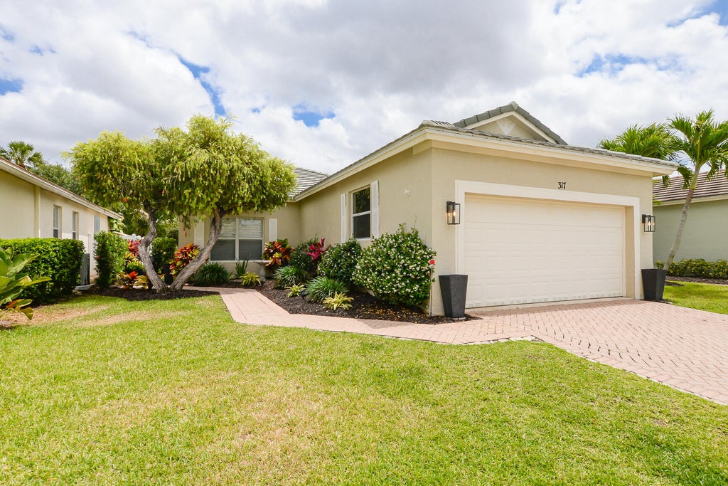 Photo of 317 SW Coconut Key Way, Port Saint Lucie, FL 34986 (MLS # R11086563)