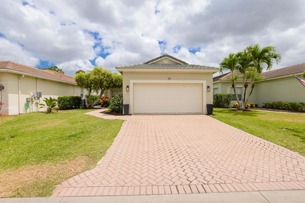 Photo of 317 SW Coconut Key Way, Port Saint Lucie, FL 34986 (MLS # R11086563)