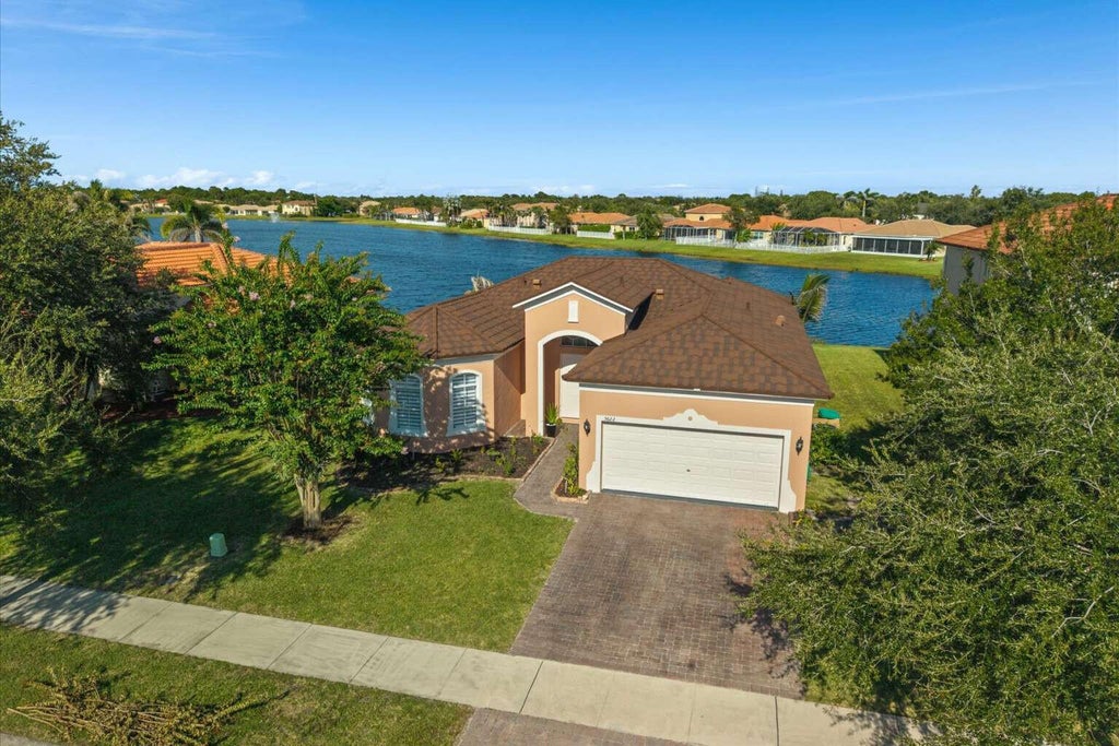 Photo of 5622 PLACE LAKE Drive, Fort Pierce, FL 34951 (MLS # B26066731)