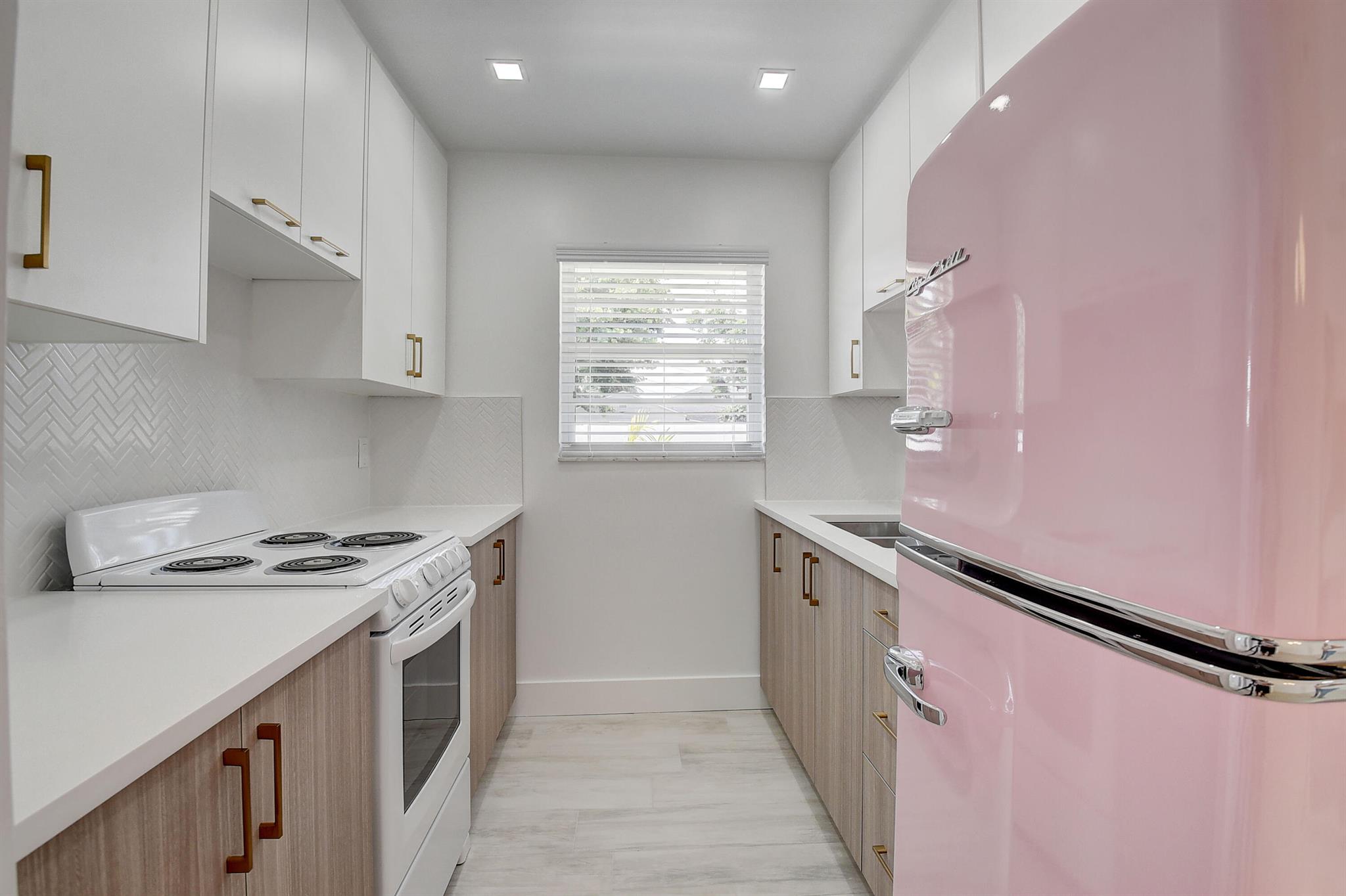 Live in Comfort & Style in this beautifully updated apartment just over a mile from the beach and steps from downtown! This thoughtfully designed unit offers: High-End Finishes including sleek quartz countertops and a charming Big Chill retro refrigerator, In-unit washer & dryer for ultimate convenience. Central A/C and impact windows and doors for comfort & peace of mind. Tropical landscaping with elegant outdoor lighting - perfect for evening relaxation. Private off-street parking included. Walk to shopping, salons, breweries, restaurants, art & music venues. Perfect for anyone looking to enjoy a vibrant, walkable lifestyle with modern amenities and beach-town vibes.