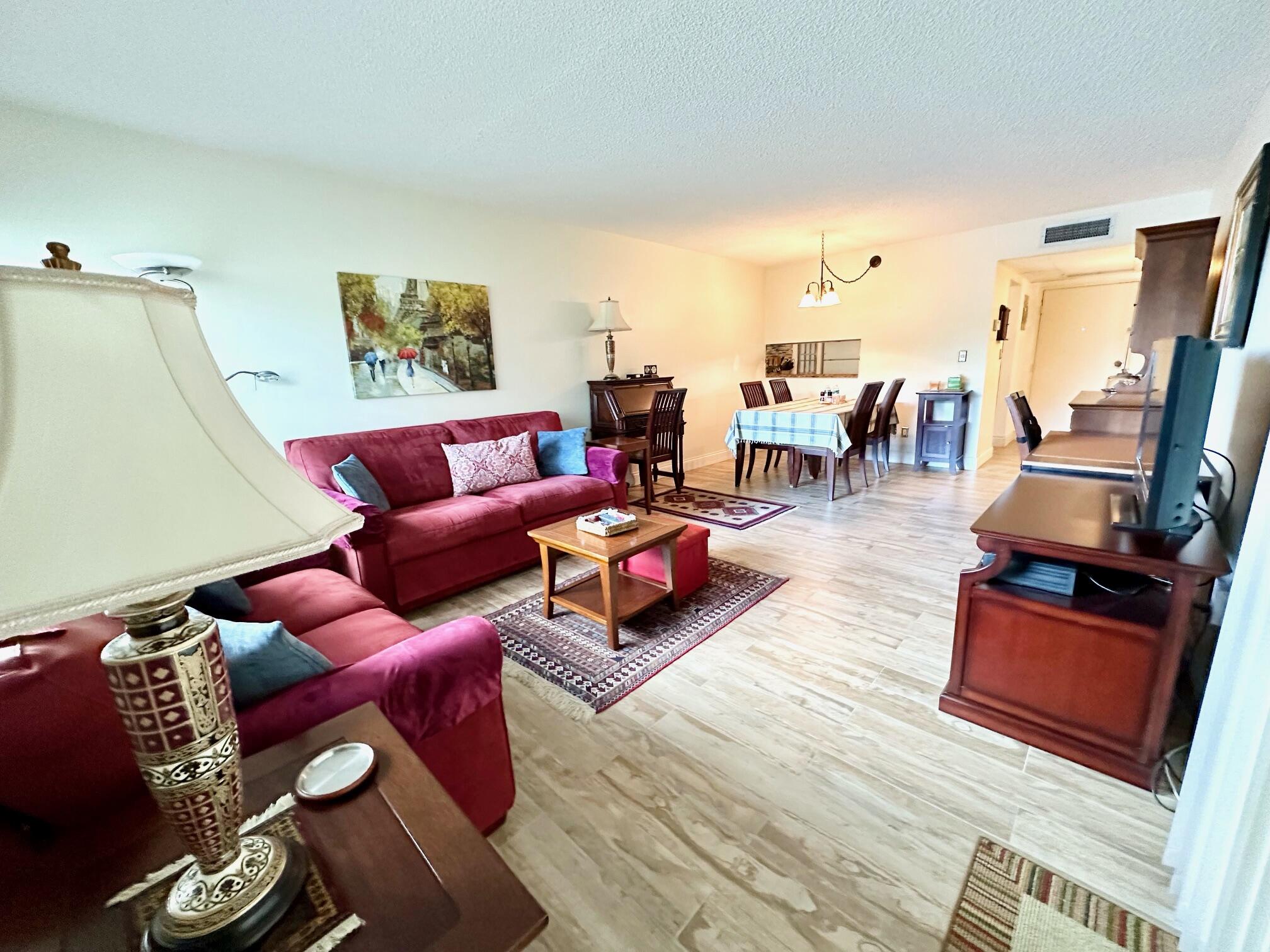 MUST SEE. PLEASE SUBMIT A FULL REPORT INCLUDING INCOME & ID WITH ALL OFFERS. IMMACULATE, FRESHLY PAINTED UNIT. BRIGHT 1ST FLOOR CORNER LAKE FRONT CONDO. ALL NEWER WOOD LOOKING PORCELAIN TILE THROUGHT UNIT. UPDATED KITCHEN WITH GRANITE TOP. UPDATED BATHROOMS. WATER & CABLE ARE INCLUDED. FULL SIZE WASHER & DRYER & STORAGE IN THE PATIO. COMMUNITY INCLUDE 2 POOLS ( 1 HEATED), BASKETBALL, TENNIS, COMMUNTY ROOM, JOG/BIKE TRAILS & PICNIC AREAS.