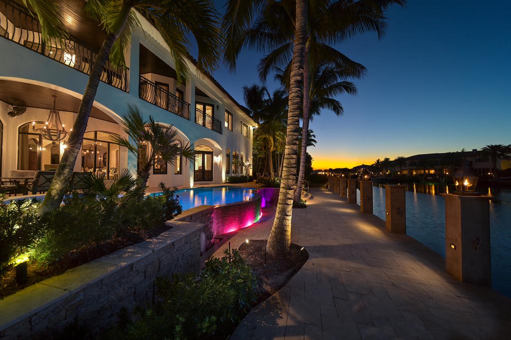 RARE OPPORTUNITY! ONE OF THE MOST UNIQUE & DESIRABLE HOMES IN LIGHTHOUSE POINT!Newly refined, 180' deep water luxury estate & attached landscaped lot presides over the South Grand Canal of Lighthouse Point. This timeless estate boasts 5,663 sqft of living space featuring picturesque views from nearly every room! Completely remodeled smart home reflects its elegant design, neutrality & quality craftsmanship throughout. Ample space and serenity to enjoy parking your 100+ foot yacht & toys along the 180' deep water straight marble dock. A must see property! The additional buildable attached lot currently has a putting green and bocce ball court-- but the space allows for maximum freedom and usability. Luxury living at its finest!