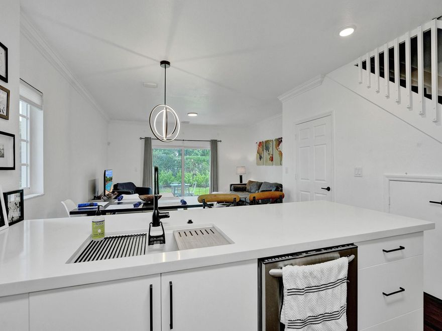 Welcome to the exclusive BELLA VISTA Community. Enjoy PEACE and SERENITY in this tastefully UPDATED 3 BD/2.5BR townhome. A LARGE kitchen with CUSTOM cabinets UPDATED appliances including washer and dryer. The second floor includes a BEAUTIFUL primary bedroom and bath with WALK-IN CLOSETS as well as 2 LOVELY additional bedrooms with a joint bathroom. This home has all IMPACT windows & doors, and waterproof laminated flooring throughout. There's a lot of storage. 1 CAR GARAGE plus 2 additional assigned parking spaces. Enjoy the LARGE community pool and patio area. FANTASTIC clubhouse with a gym,  24/7 SECURITY with a AMAZING Park and Playground. Located close to I-95, shopping, restaurants, and much more. You'll fall in love at first sight!!