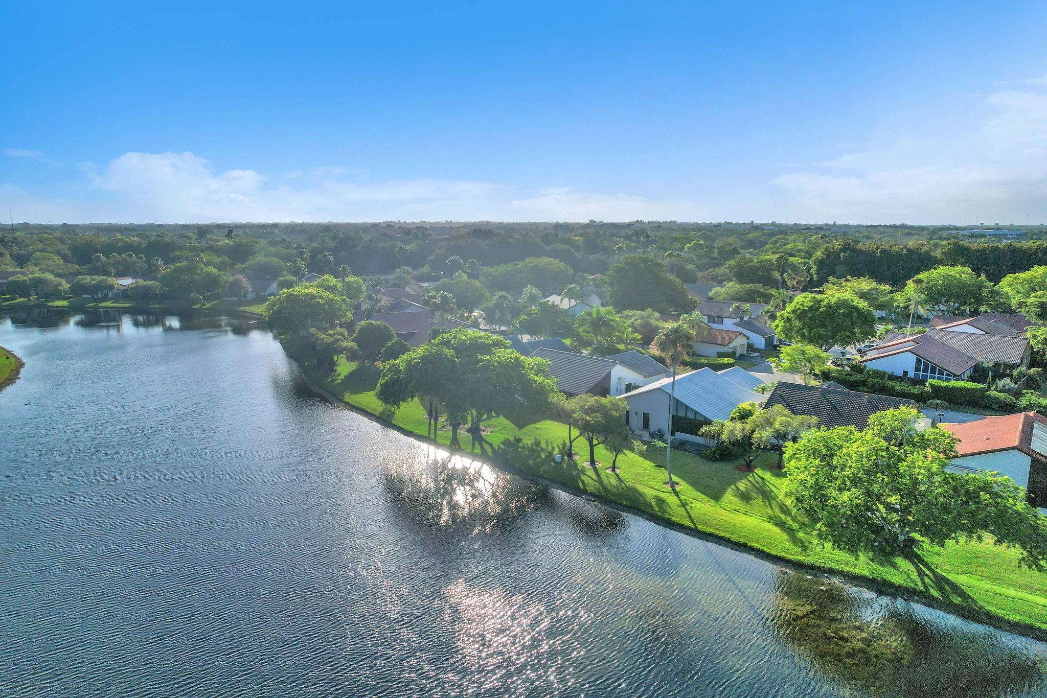 This beautifully revamped 3-bedroom, 2-bath waterfront home is move-in ready and waiting for its new owners. Step inside to find a bright and open floor plan with a freshly painted interior, newly textured ceilings, and a crisp feel throughout. The exterior has also been updated with fresh paint, giving the home standout curb appeal. The home features a newer A/C (2019), new reinforced garage door opener, new water heater (2023) and new hurricane shutters and more. Step outside to your spacious screened lanai, the perfect spot for relaxing or entertaining while enjoying tranquil water views. Located in a highly sought-after Weston neighborhood, this home is just minutes from top-rated schools, major airports, premier dining, and shopping destinations.
