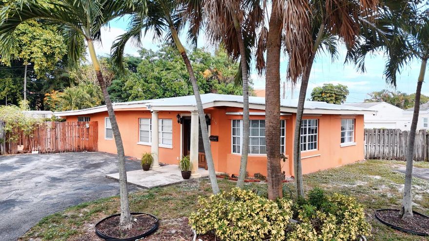 Opportunities with this combination of location, square footage, and room to grow don't come up often—this is one worth grabbing.

Welcome to a generously sized residence in one of the most coveted pockets of town—just blocks from the Palm Beach Zoo, the Cox Science Center & Aquarium, and minutes to Downtown West Palm Beach, the waterfront, and Palm Beach International. Set among tree-lined streets with a true neighborhood feel, this location blends suburban comfort with unbeatable city access.

Inside, an updated kitchen, tile flooring throughout, and a spacious layout create an easy sense of flow with plenty of room for gatherings, creative furniture layouts, and future design touches. Large windows bring in beautiful natural light, enhancing the home's warm, open atmosphere. Step outside to a welcoming yard with space to garden, grill, or unwind beneath mature trees. It's comfortable from day one, with the freedom to elevate and personalize as you go.

A rare chance to plant roots in a community people truly love.