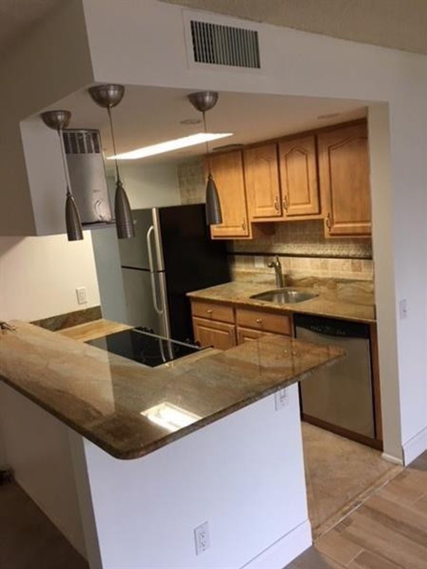 "Sorry not showings "This unit is gorgeous; spacious 2 bedroom, 2 bathroom unit located in the gated community. Just painted, wood floor and tile through out the living area, along with a split bedroom floor-plan with walk-in closets. Granite counter in the kitchen and stainless appliances. Enjoy extra storage room on your own private balcony. Amenities include gym, pool and tennis courts. Located close to the casino, main roads, shopping and dining.