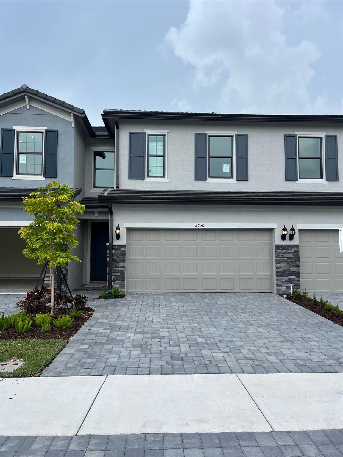 BEST VALUE in Oak Tree! Brand New Adirondack townhome with beautiful lake view ready for immediate move in! Adorned with tons of upgraded finishes - this one will not last long! Special finance incentives available through builder's in-house lender.