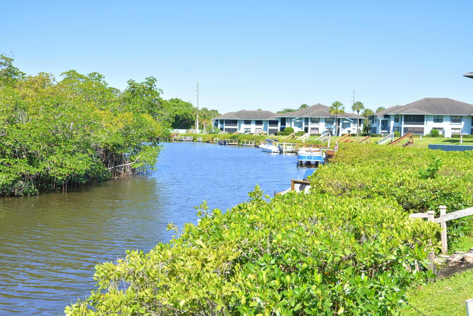 Discover this move-in-ready 2BR/2.5BA townhouse in the heart of Stuart, featuring two spacious master suites, ample built in storage and a screened patio with tranquil views of Poppleton Creek. Perfect for relaxing or entertaining. Less than 2 miles to vibrant downtown Stuart-walk or bike to restaurants, shops, local markets, and nightlife! Enjoy waterfront views, community pool, and easy access to beaches. Pet friendly (with restrictions) HOA includes roof coverage. Don't miss this rare opportunity for affordable luxury and location!