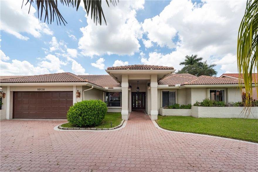 JACARANDA LAKES 4/ 2.5 bath waterfront pool home located in a kid friendly neighborhood.  Great curb appeal w/ a circular driveway and 2 car garage.  The living rm, dining rm, and family rm areas have vaulted ceilings and flow into the kitchen which features an island and eat in kitchen.   The stacked bedrooms make this home perfect for a growing family!  The Master Bedroom has two large walk-in closets and access to the pool/patio.  The Master Bath has dual vanities and separate tub and shower.  Entertain guests Florida style while relaxing in the screen enclosed pool.  Fantastic water views of the pool and canal from most rooms.  All windows have accordion shutters as well as accordion shutters across the covered patio.  Walking distance to shopping, schools, and places of worship.