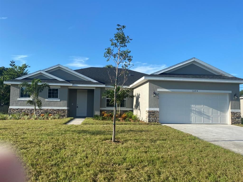 Photo of 1094 SW London Lane, Port Saint Lucie, FL 34953 (MLS # R10747832)