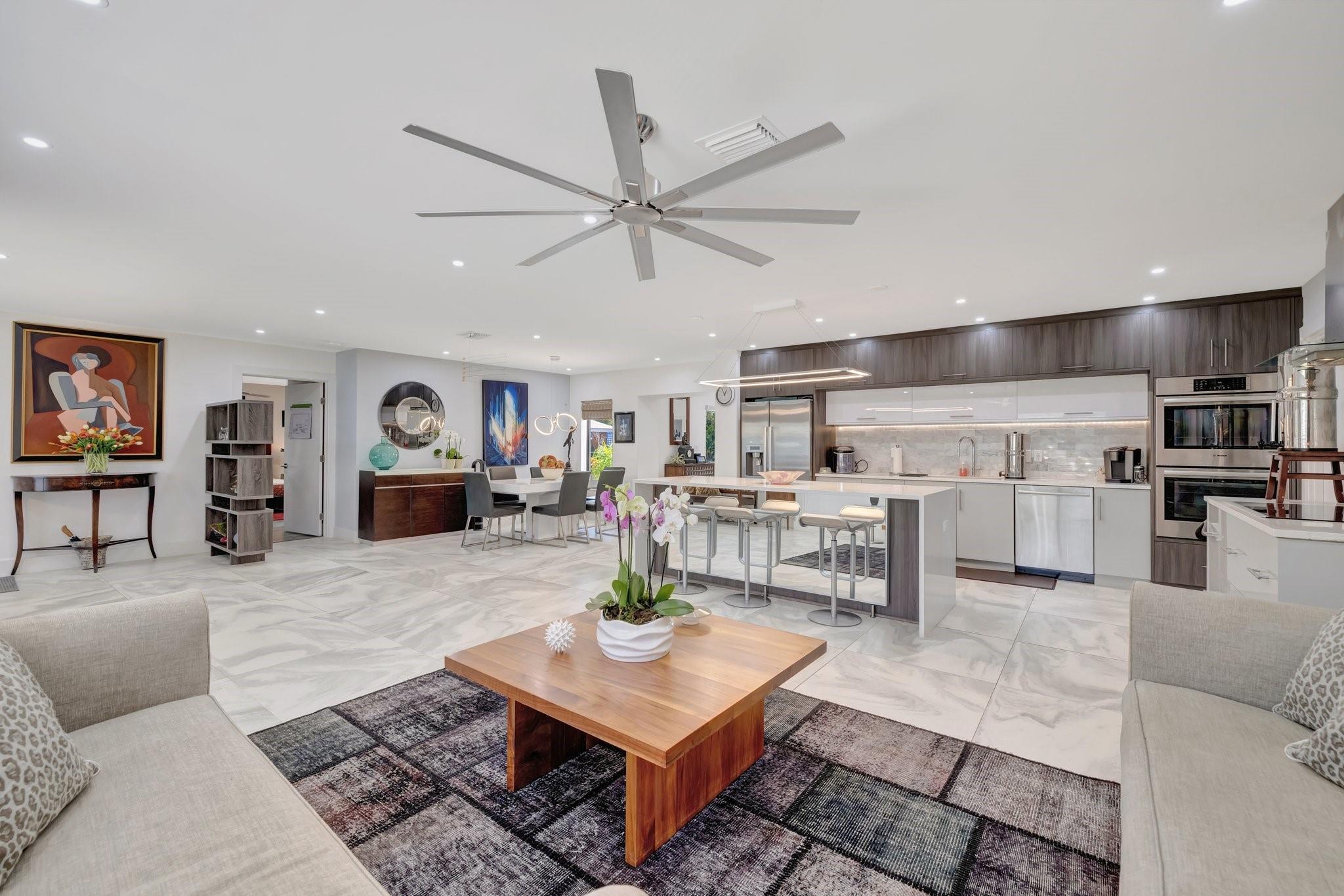 Amazing move-in ready Wilton Manors home ENTIRELY redone in 2021. 2,440 sq ft on 11,000 sq ft lot! Gorgeous open & expansive living area, stylish European kitchen with island, quartz tops & Bosch appliances. Split floor plan, huge master suite overlooking the heated salt water pool with travertine deck, cabana bath & a very cozy, incredibly lush backyard with pergola, shed & many fruit trees = a dream to entertain friends & family. Fully paid for 2 yr old solar panels power the entire house (HUGE savings!). Rv garage with tall ceilings is perfect for your massive storage needs. Also a desirable metal roof, all PGT impact openings, 2 tankless H2O heaters, recessed lights, 32" porcelain tiles. The sprinklers are on well = huge savings & anti rust system. Make this Your tropical oasis!