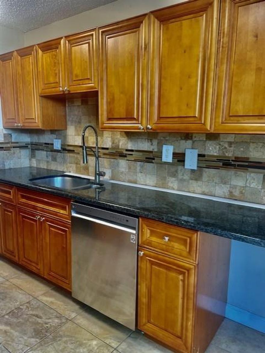 Large 1 bedroom 1 and a half bathroom first floor condo for rent. The kitchen has granite countertops and plenty of cabinets. Full size washer and dryer in unit. Tile flooring throughout. Great lake front location. First, last and security to move in.