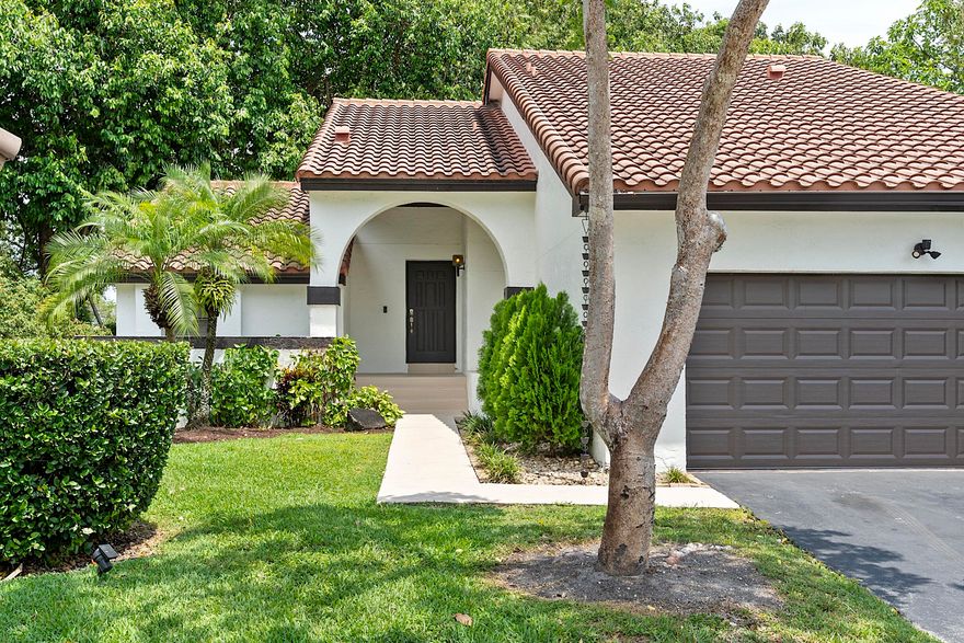 Beautiful 3BR/2.5BA home in the heart of Weston featuring over 2,100 SF of living space and a 2-car garage! Located in a highly desirable community with access to top-rated schools, this home offers soaring ceilings, spacious living areas, and abundant natural light throughout. Renovated kitchen features light-gray cabinetry, sleek countertops, stainless steel appliances, and ample storage. Enjoy indoor-outdoor living with a screened patio and private backyard. Spacious primary suite includes a large vanity area and generous closet space. Major updates include roof (2011), A/C (2022), and hot water heater (2022). Conveniently located near parks, shopping, dining, and major highways!