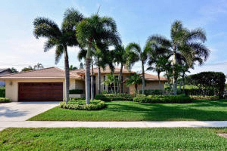 Follow the paved path into this equisite home featuring double door entry, 12' ceilings, crown molding, double sided fireplace, impact windows, french doors, hi-hat lighting, and built-ins in living and family rooms including 2 window seats! Elegant wood flooring, with no pop corn in main living areas. Custom eat-in kitchen with white cabinets, center island, double ovens/warmer drawer, Bosch diswasher, stainless appliances, and granite counters. There is also a front loading washer/dryer in spacious laundry room. Large covered patio includes built in barbeque grill overlooking heated pool and spa. Gorgeous home!