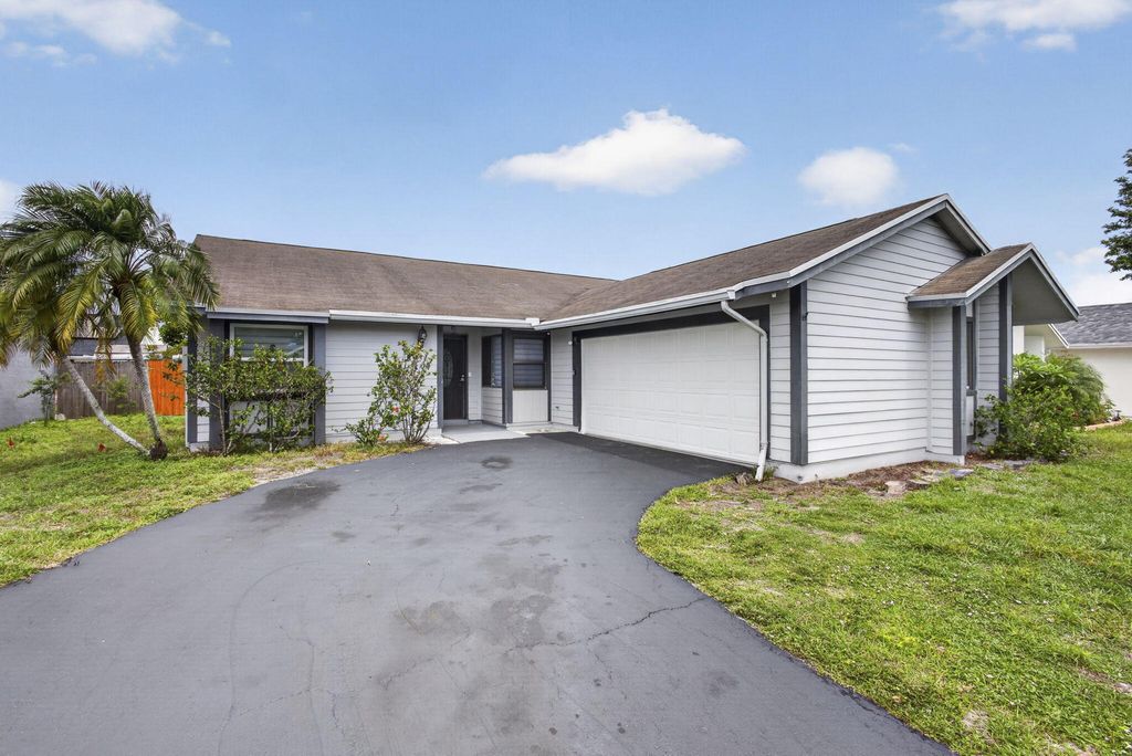 Photo of 7771 Blackwood Lane, Lake Worth, FL 33467 (MLS # B26018942)